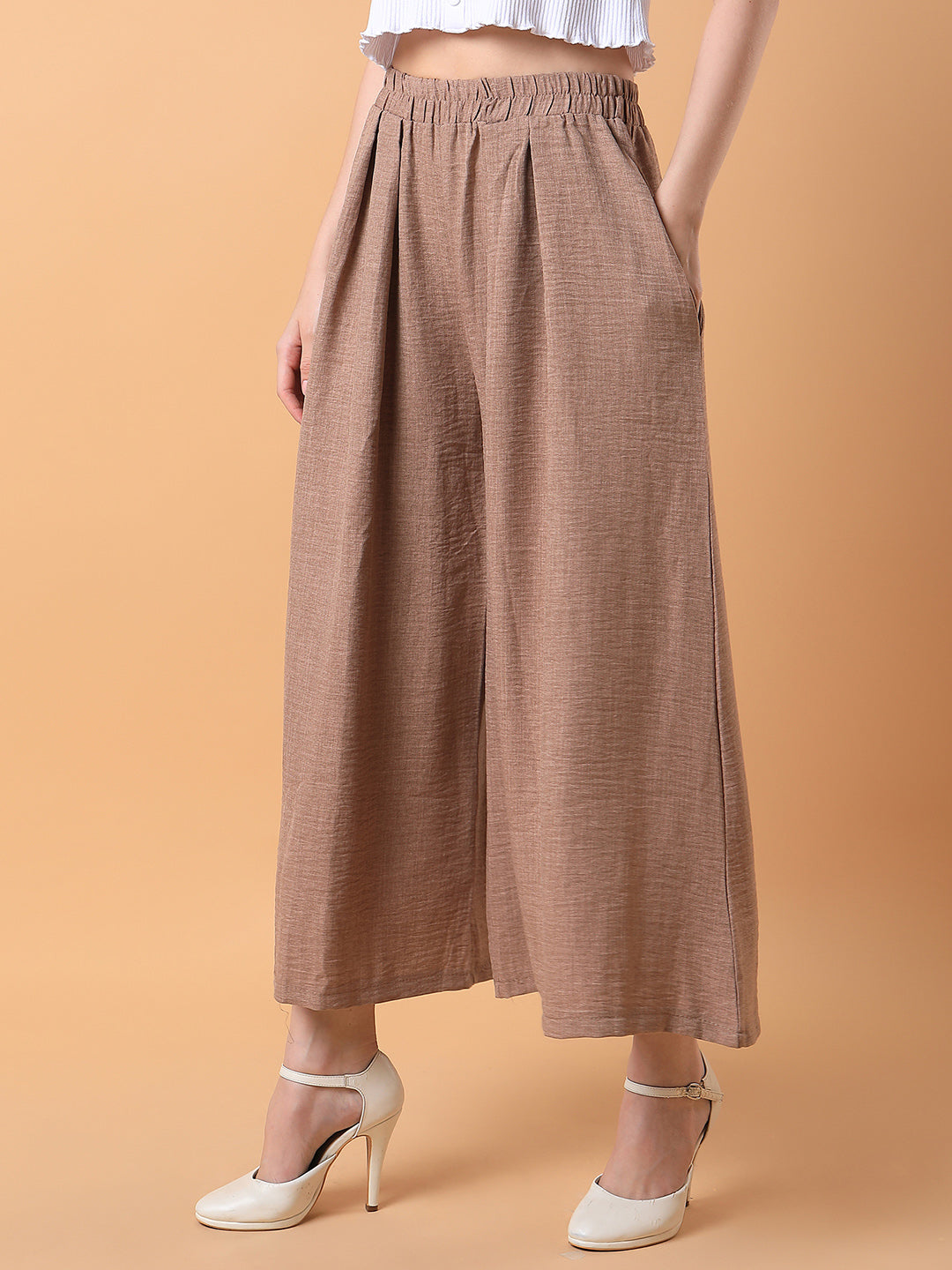 Women Solid Beige Pleated Loose Fit Trouser