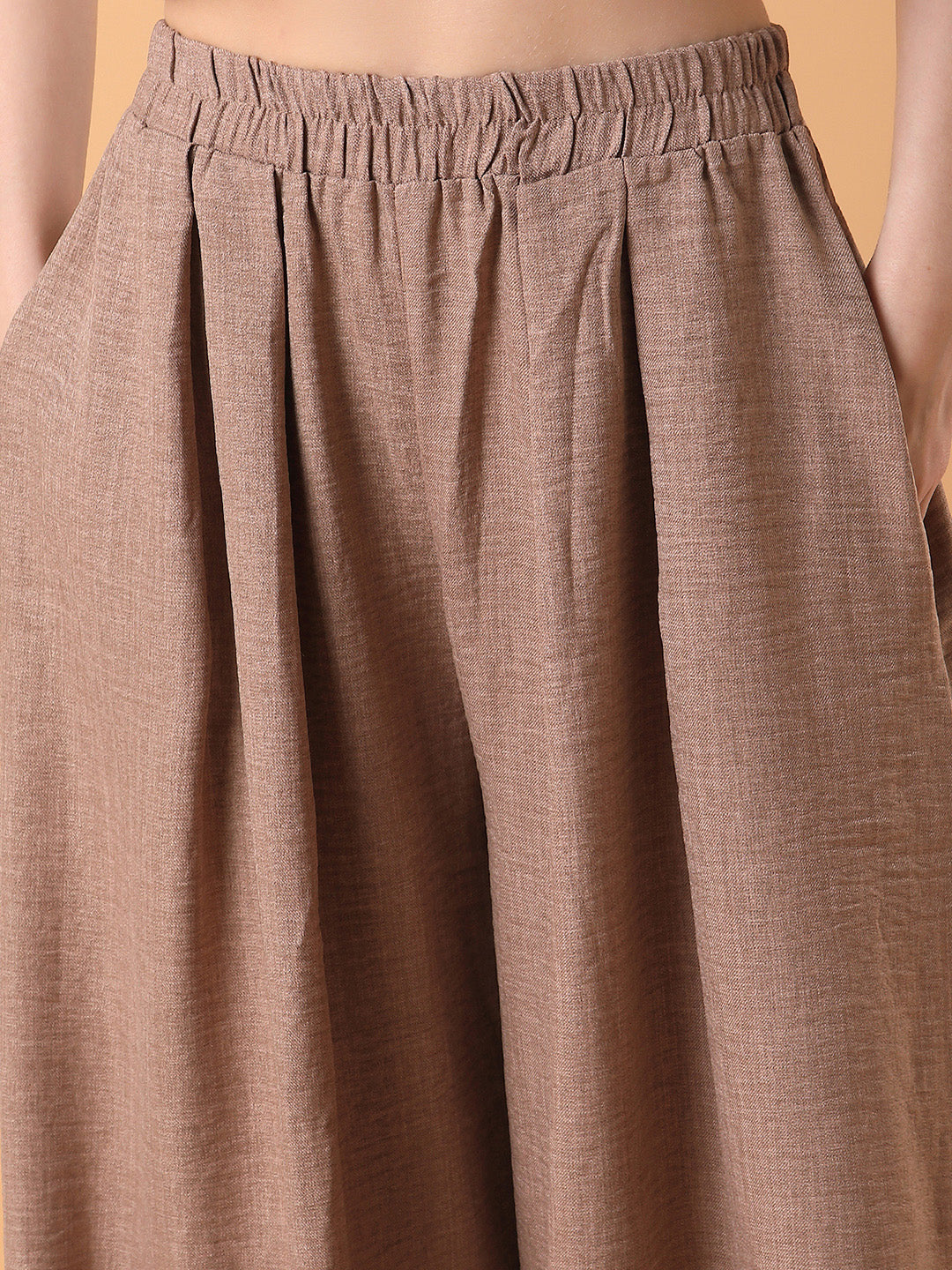 Women Solid Beige Pleated Loose Fit Trouser