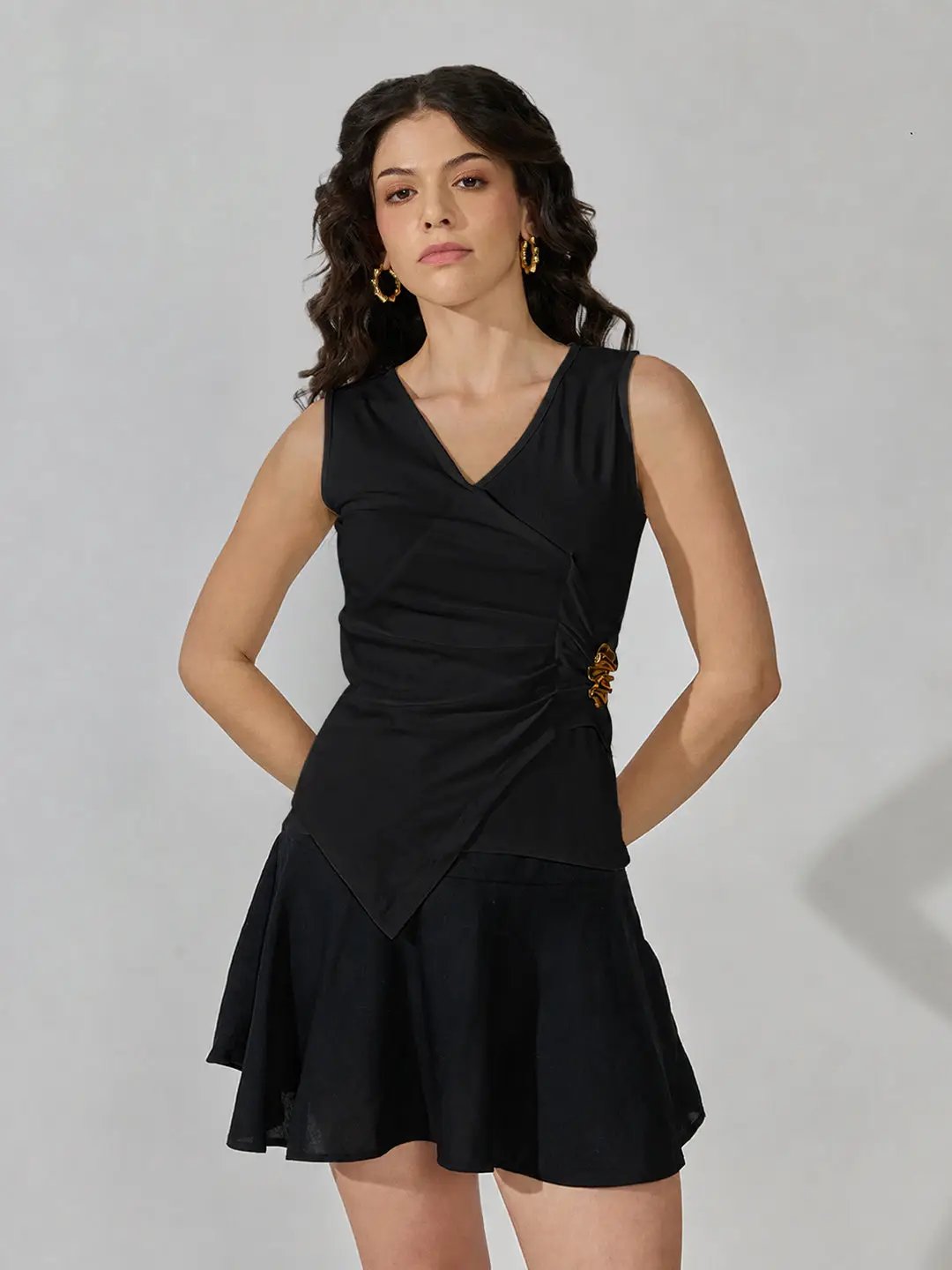 Women's Black Sleeveless V-Neck Ruched Asymmetric Top with Brooch Detail - from SHOWOFFFF