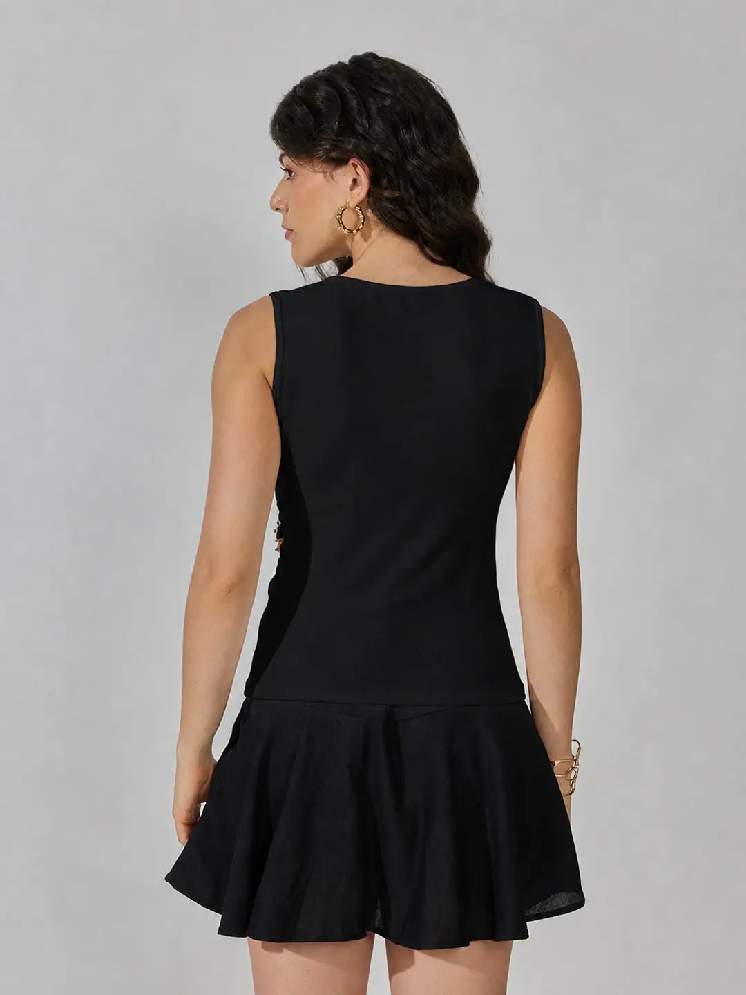 Women's Black Sleeveless V-Neck Ruched Asymmetric Top with Brooch Detail - from SHOWOFFFF