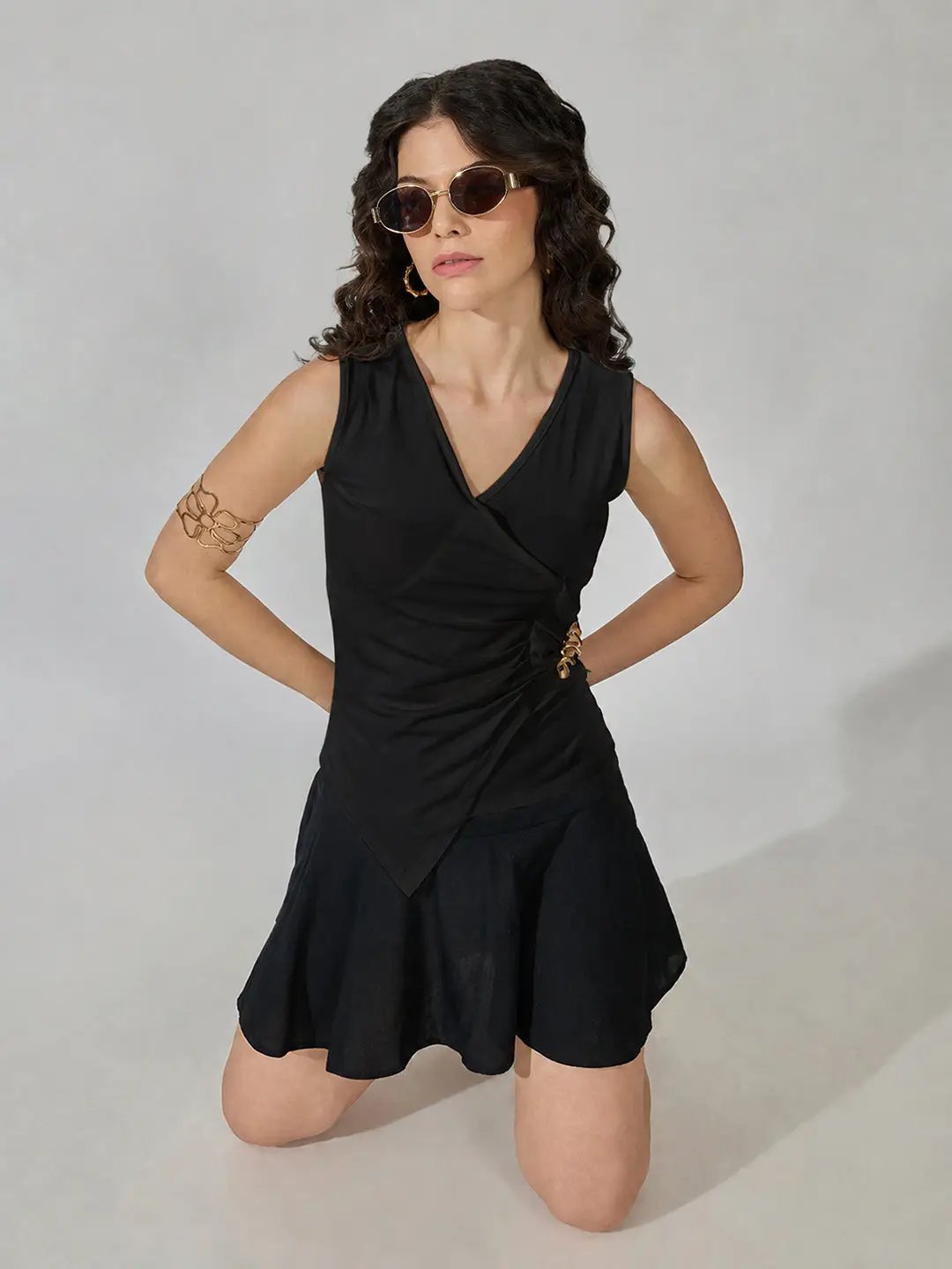 Women's Black Sleeveless V-Neck Ruched Asymmetric Top with Brooch Detail - from SHOWOFFFF