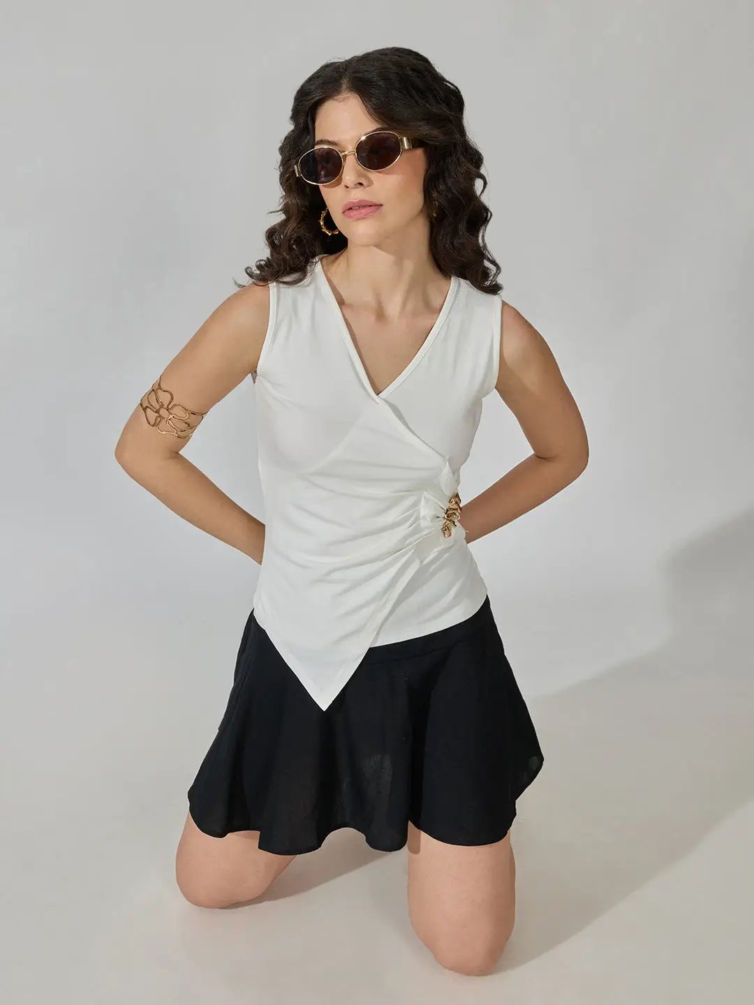 Women's White Sleeveless V-Neck Ruched Asymmetric Top with Brooch Detail