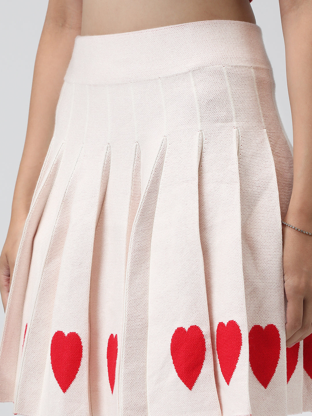 Women's Pleated Peach Mini Skirt with Heart Detail