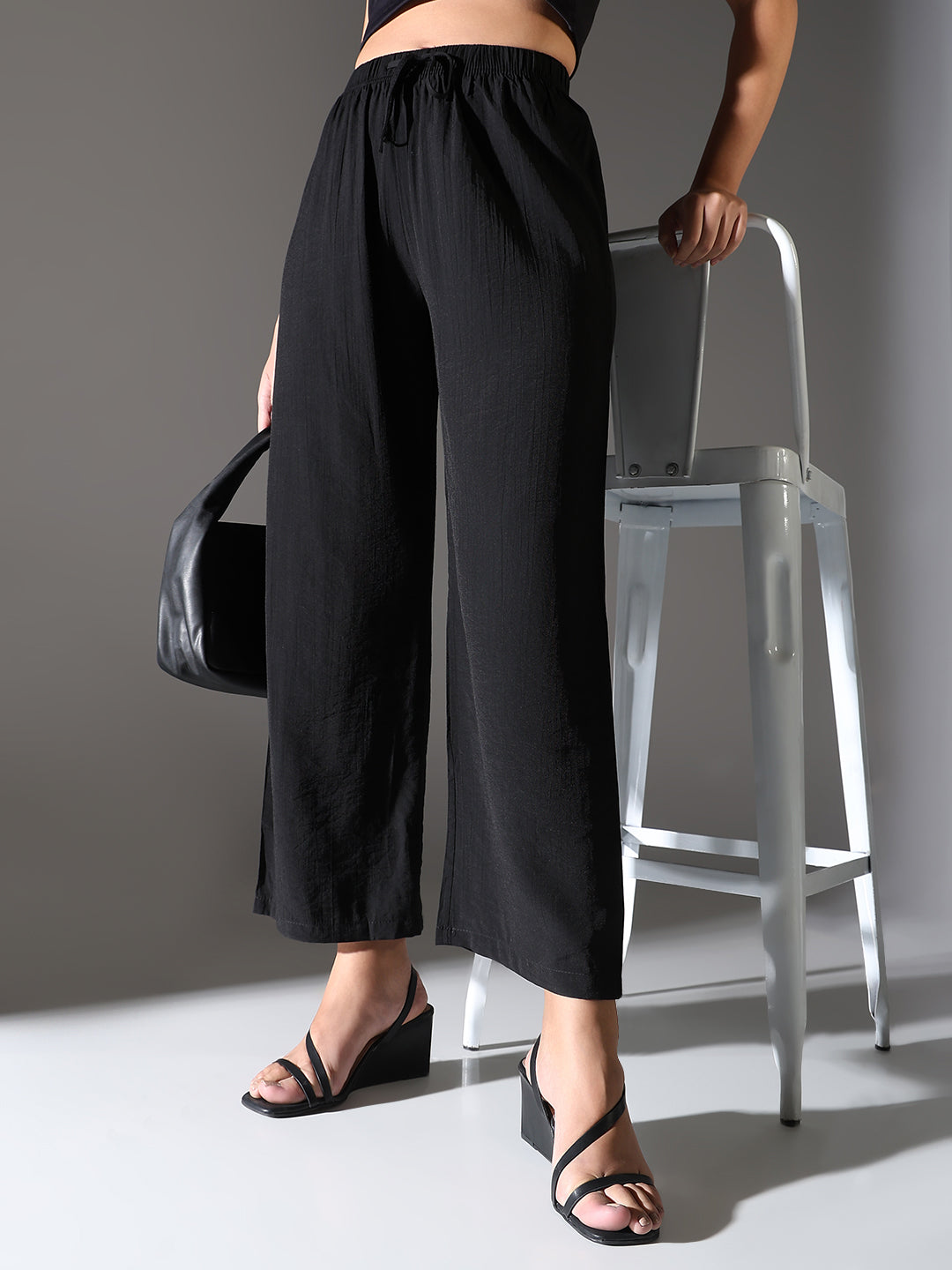 Women Black Solid Parallel Trousers