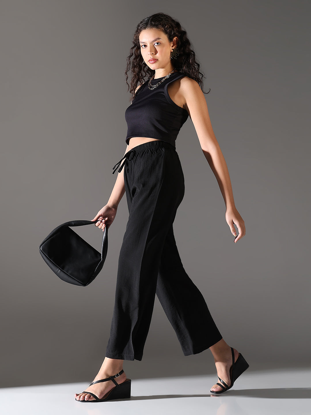 Women Black Solid Parallel Trousers