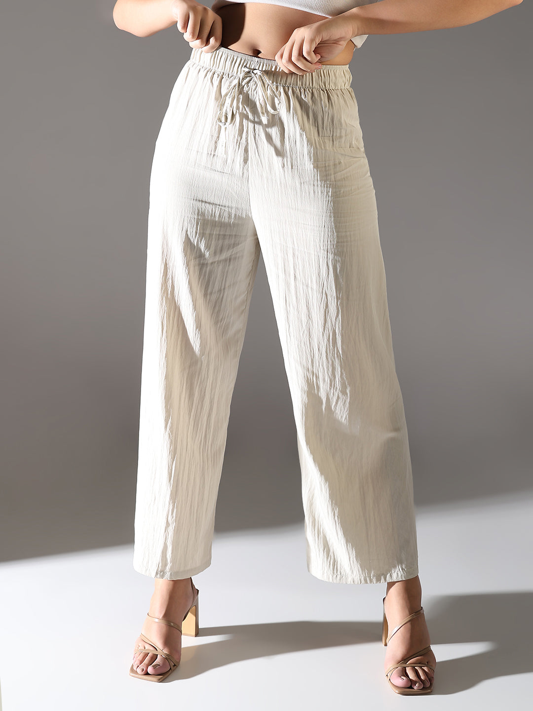 Women Cream Solid Parallel Trousers