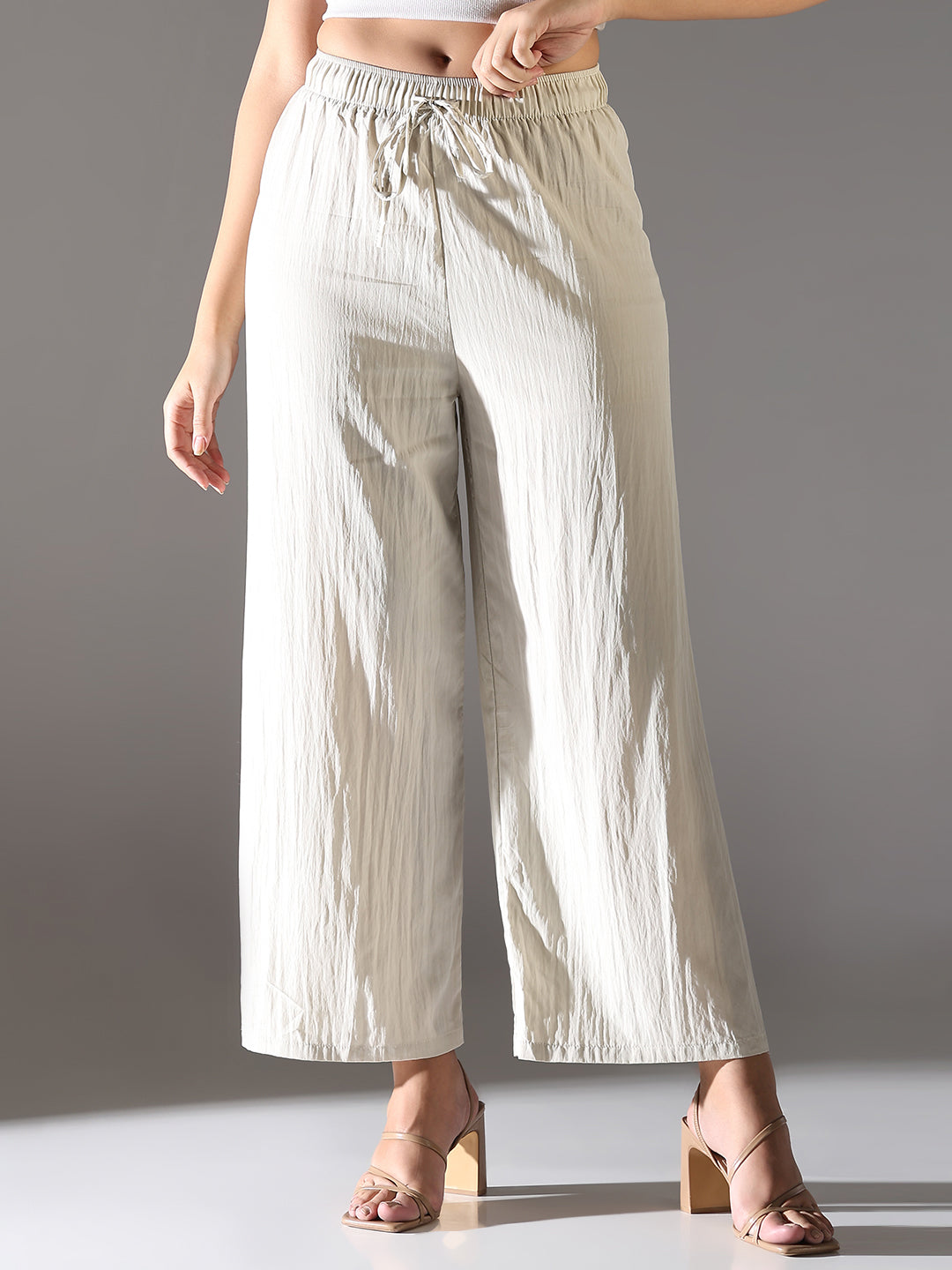 Women Cream Solid Parallel Trousers