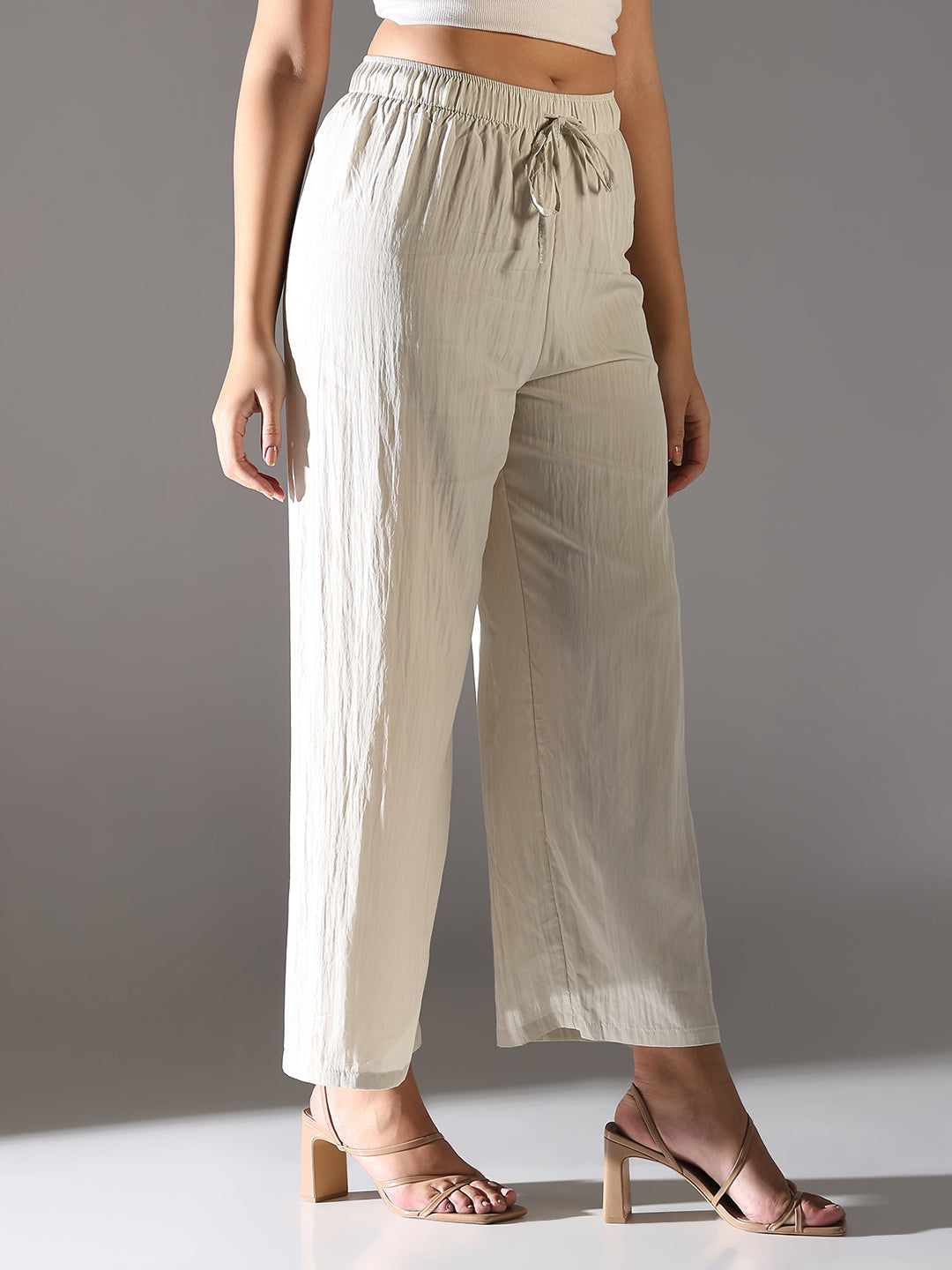 Women Cream Solid Parallel Trousers