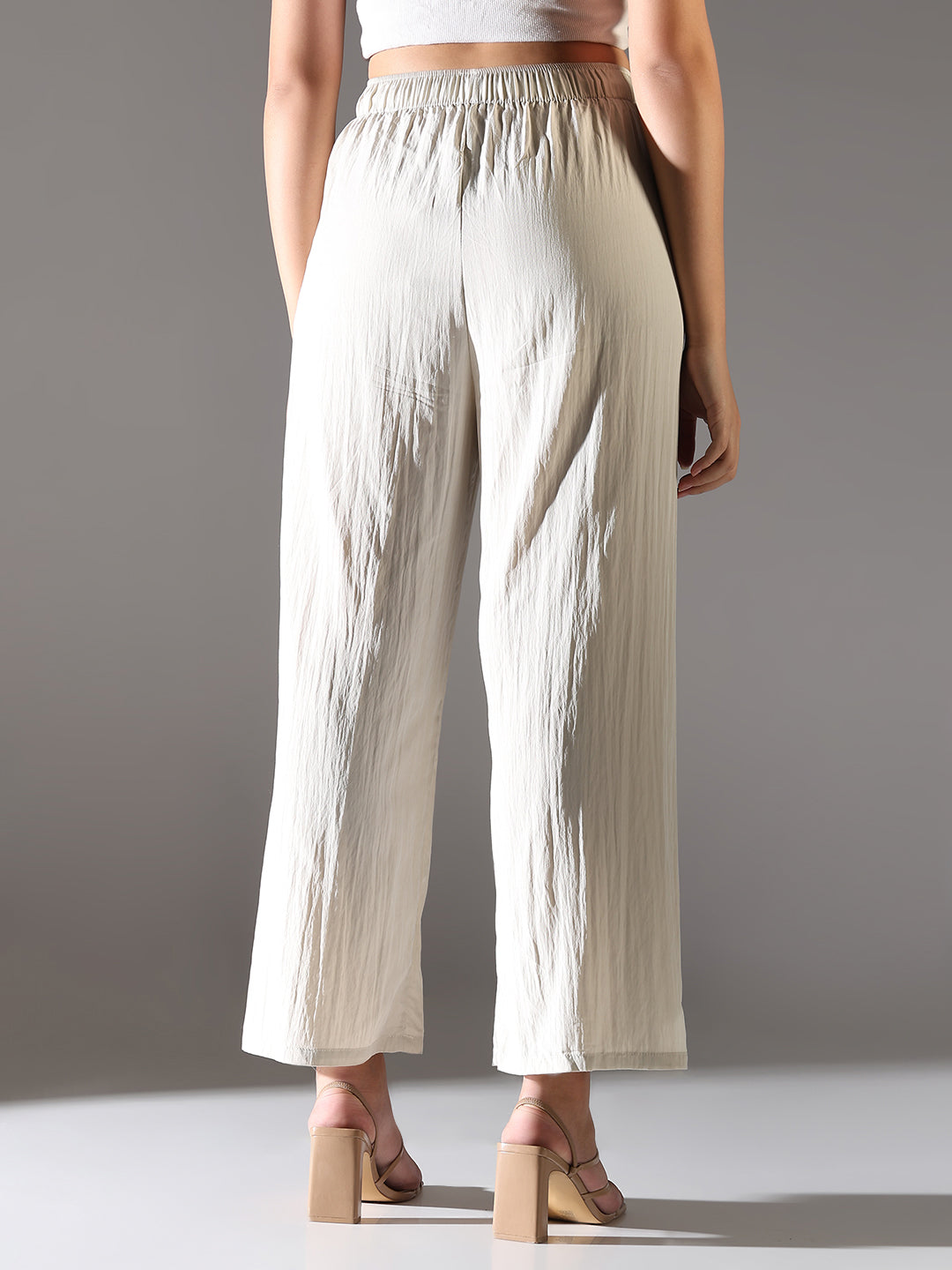 Women Cream Solid Parallel Trousers