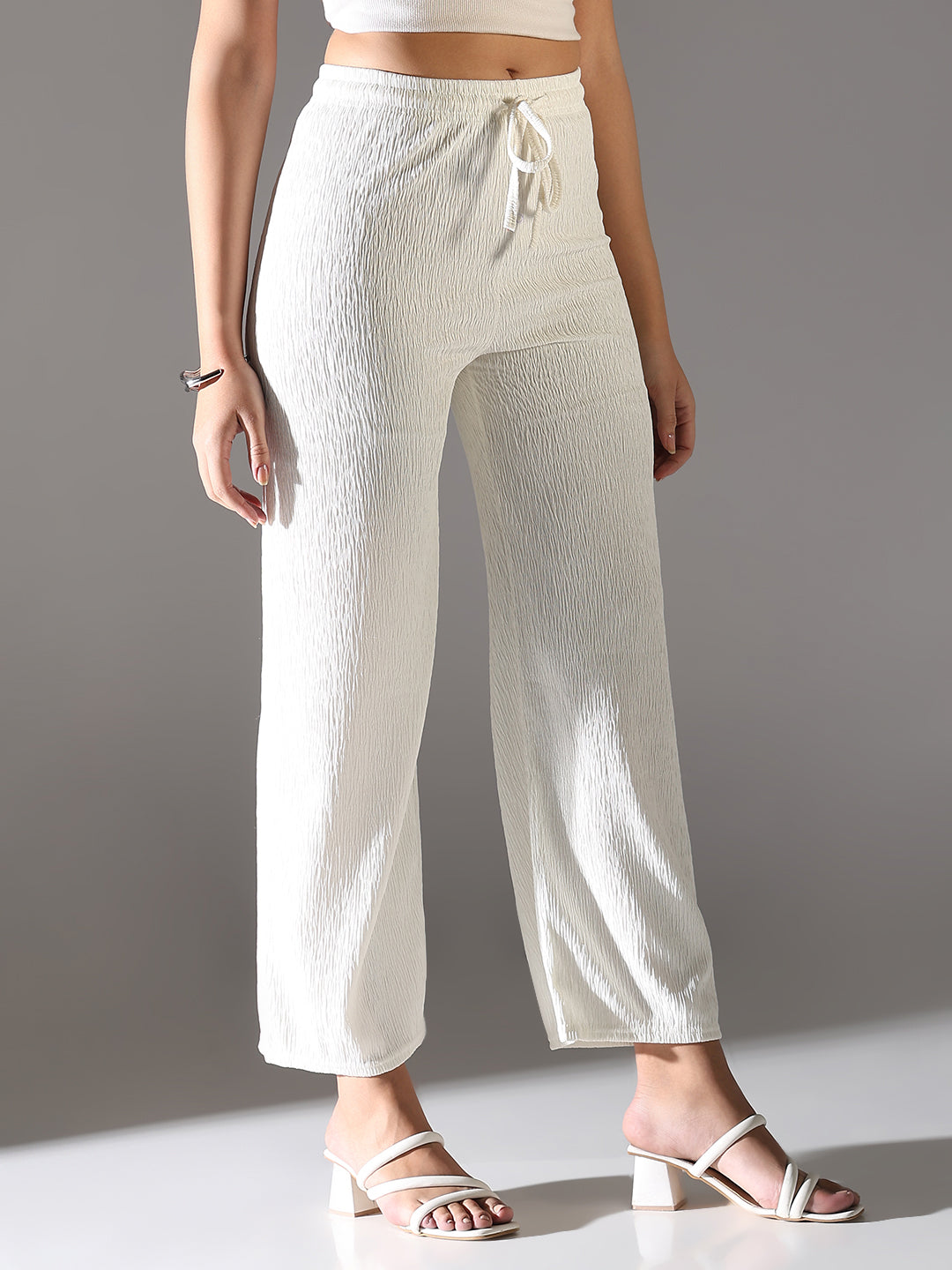 Women Off White Solid Parallel Trousers