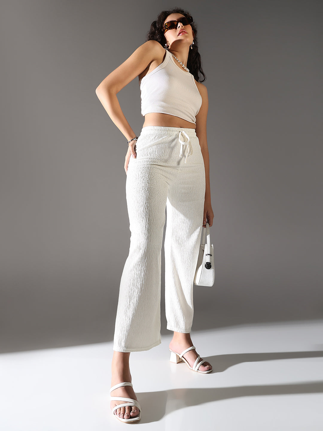 Women Off White Solid Parallel Trousers