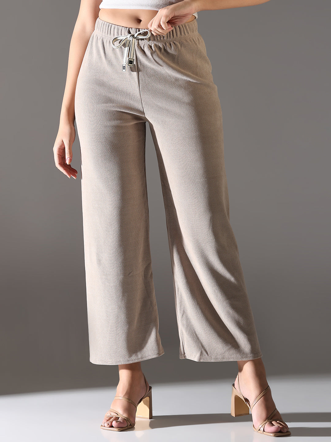 Women Beige Solid Parallel Trousers