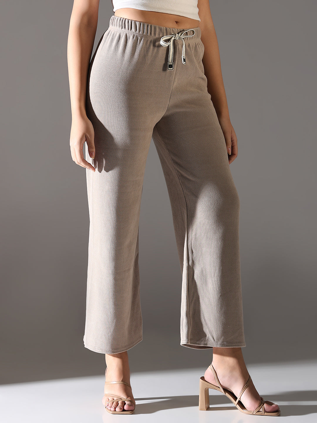 Women Beige Solid Parallel Trousers