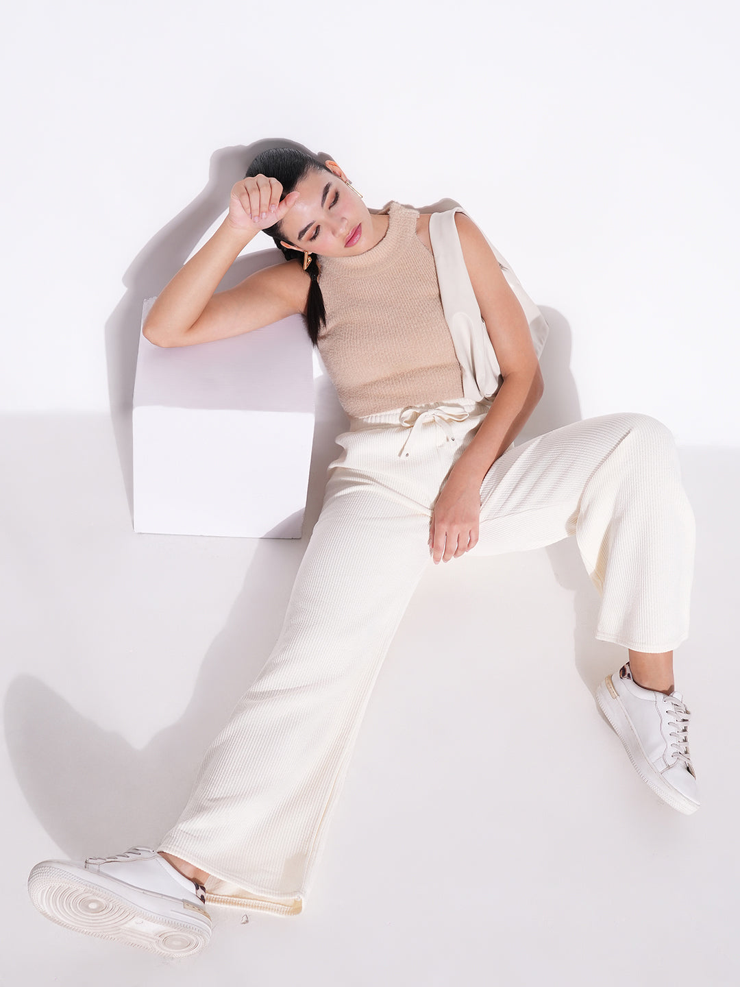 Women Off White Solid Parallel Trousers