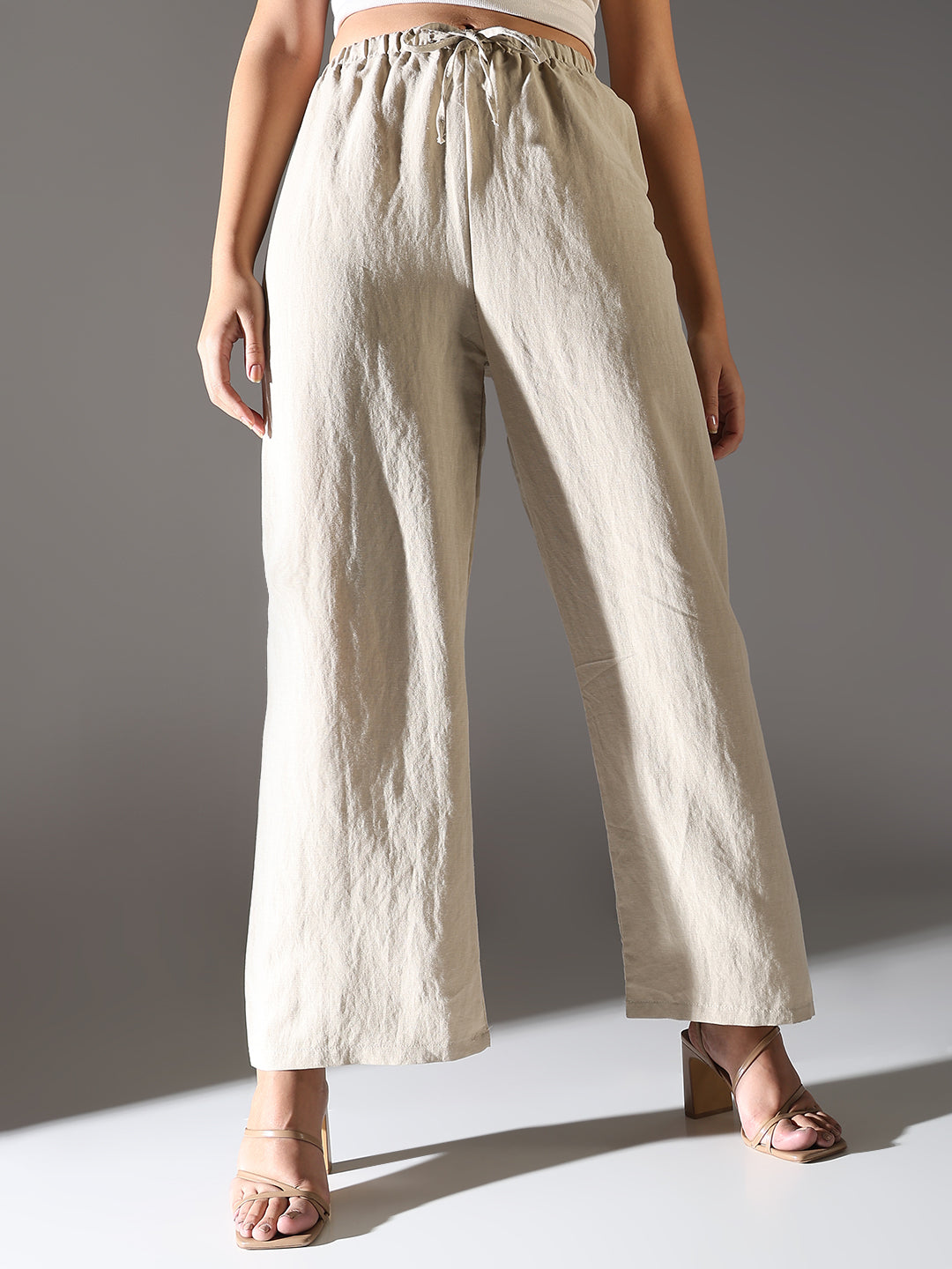 Women Beige Solid Parallel Trousers