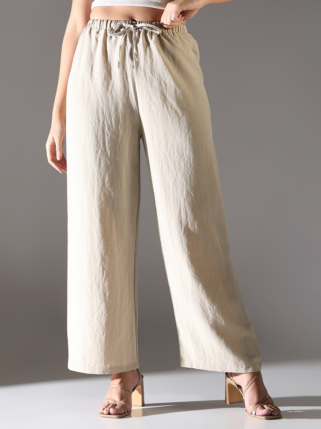 Women Beige Solid Parallel Trousers