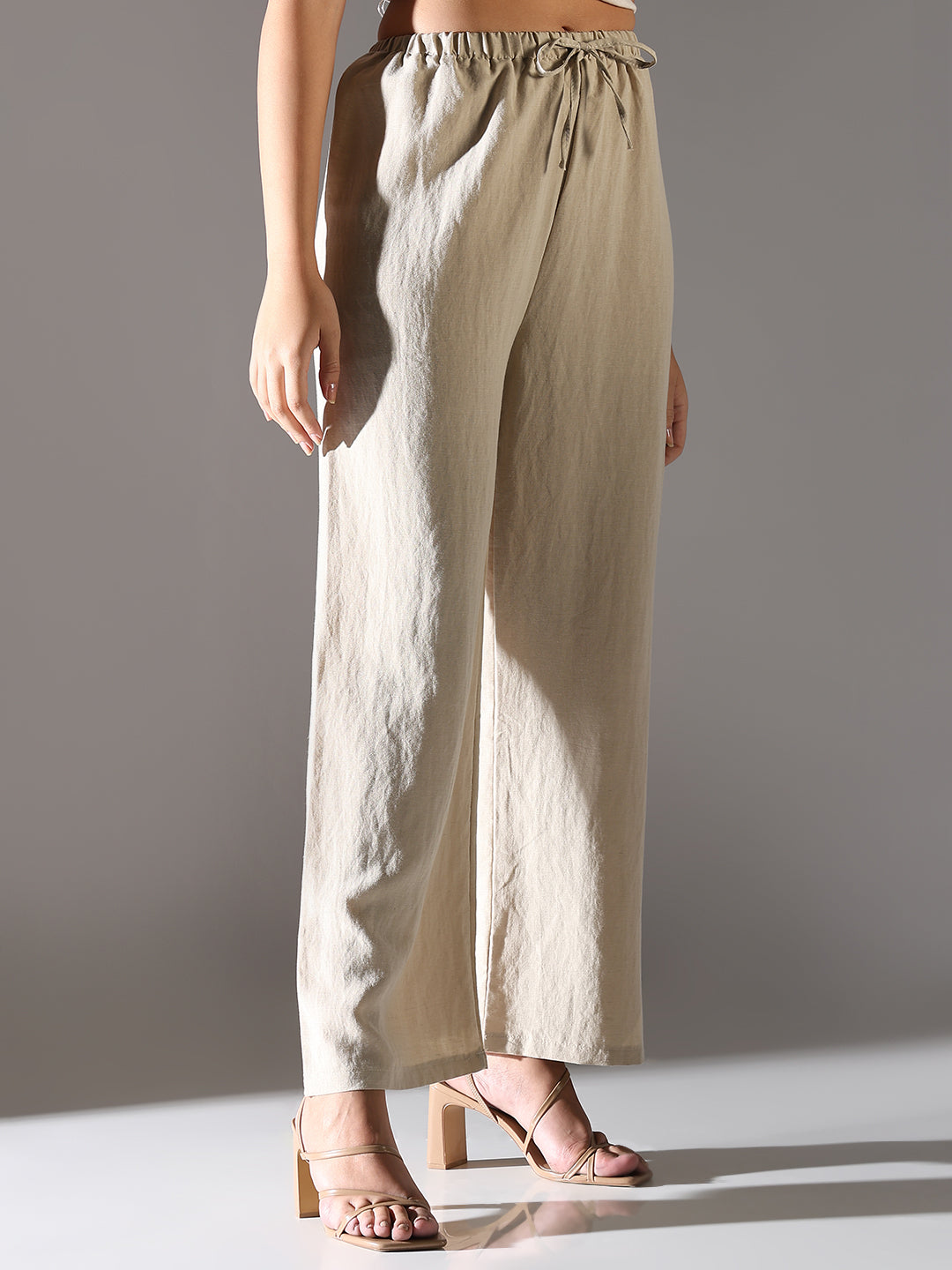 Women Beige Solid Parallel Trousers