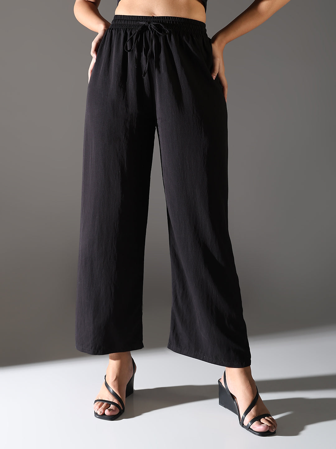 Women Black Solid Parallel Trousers