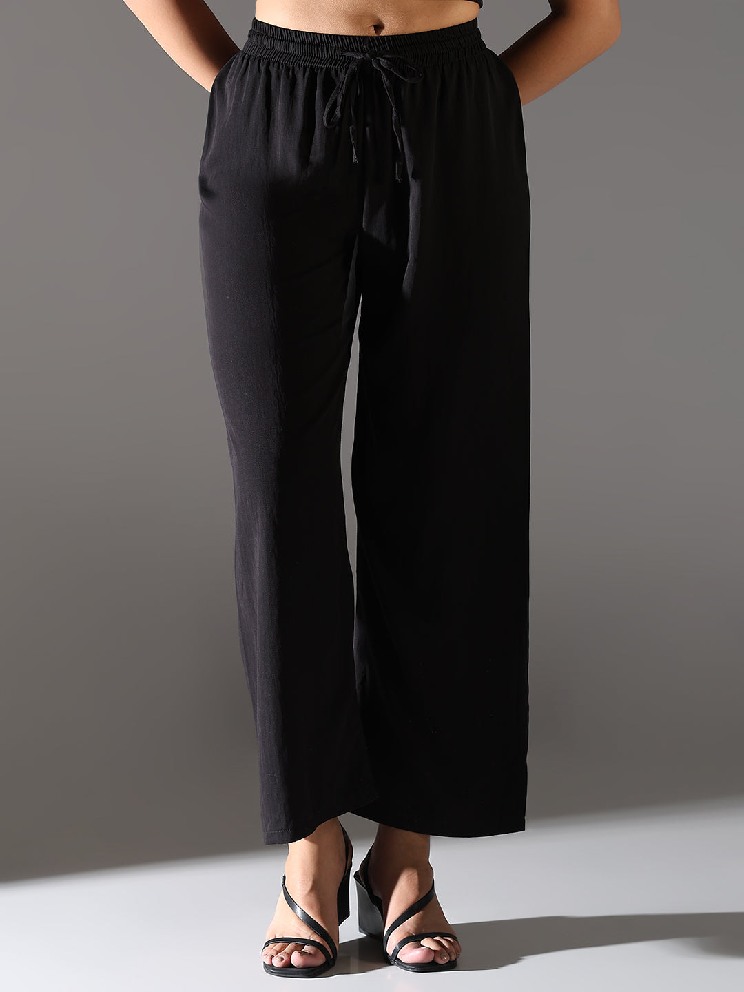 Women Black Solid Parallel Trousers