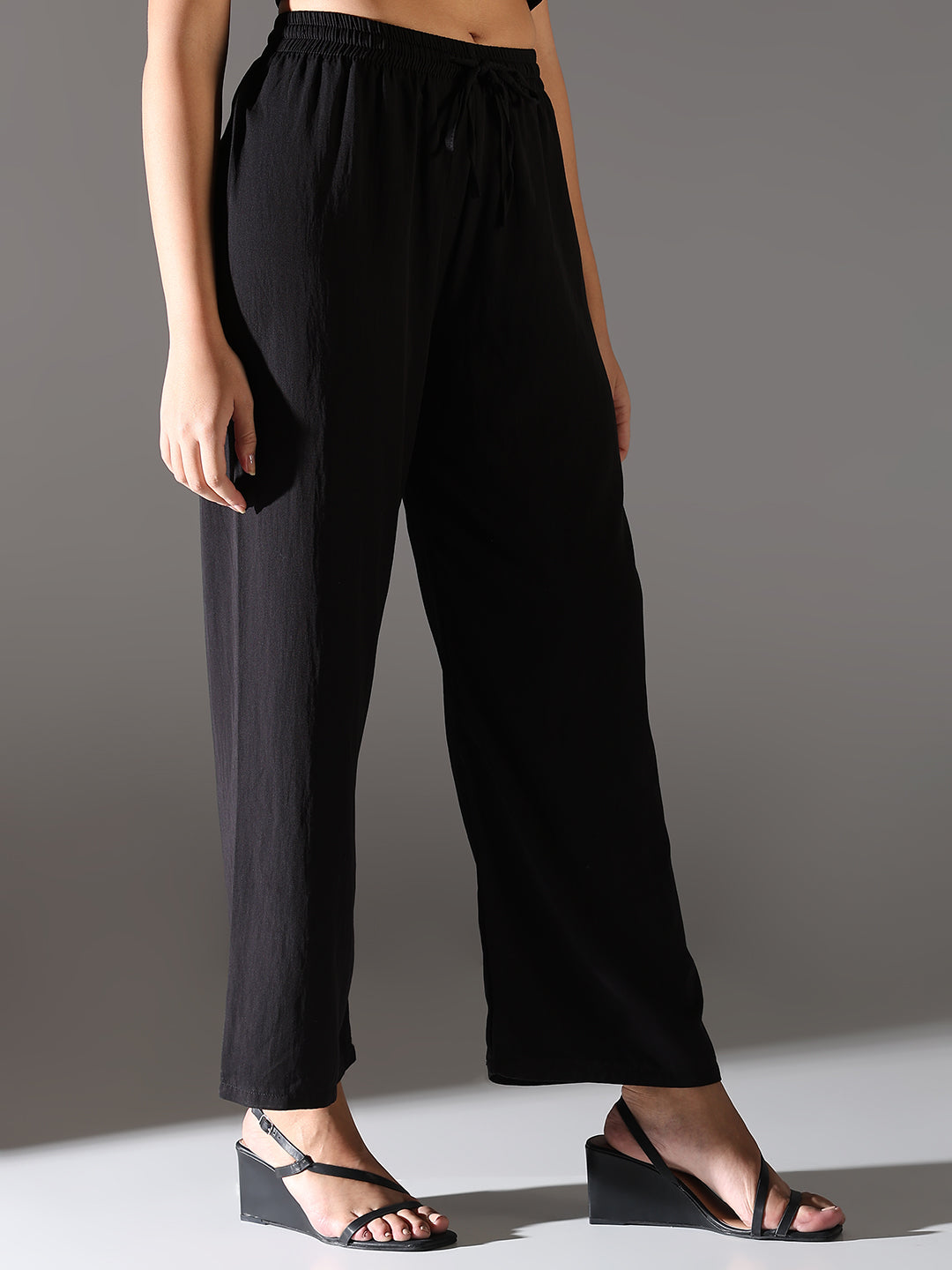 Women Black Solid Parallel Trousers