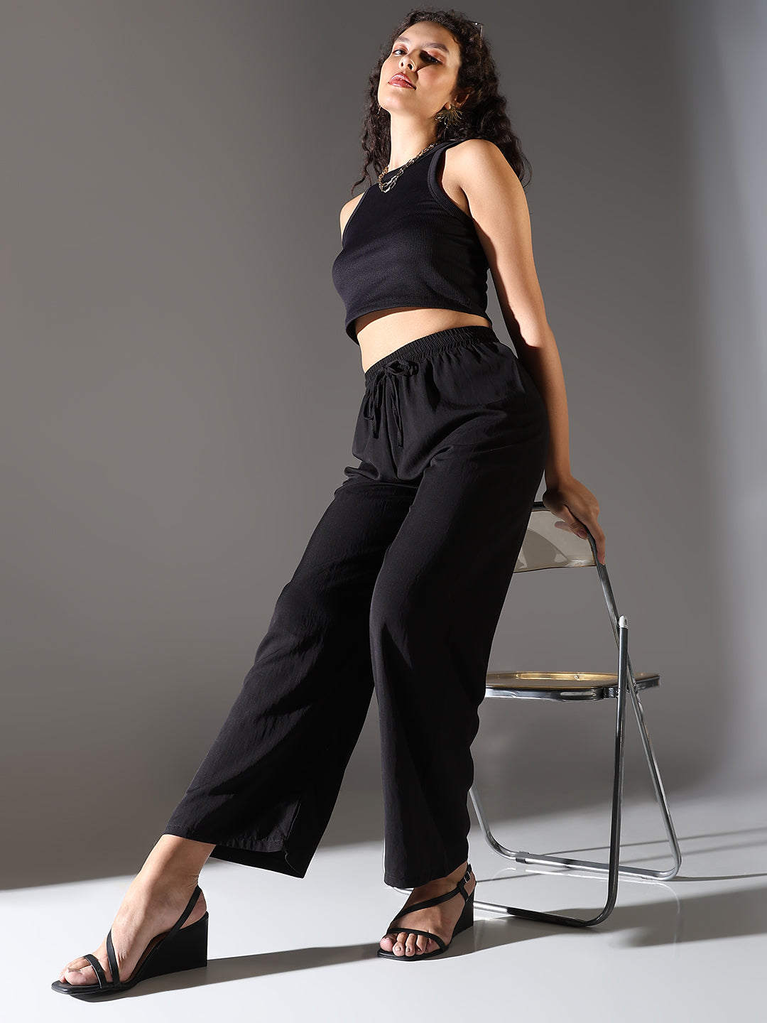 Women Black Solid Parallel Trousers