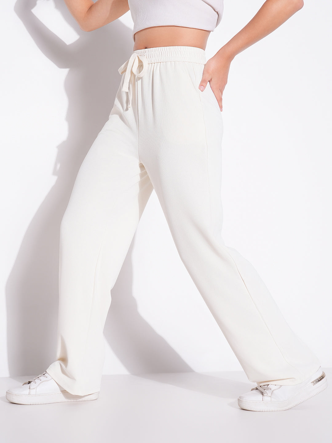 Women Cream Solid Parallel Trousers