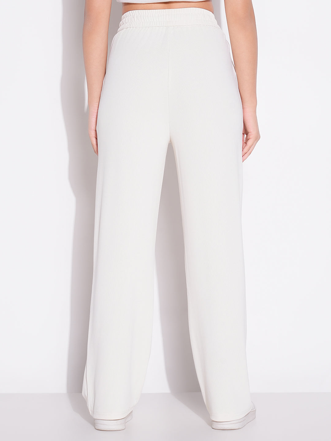 Women Cream Solid Parallel Trousers