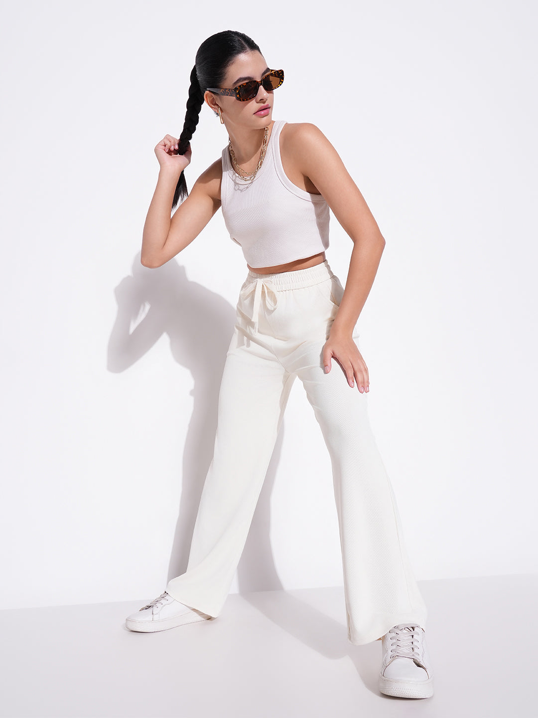 Women Cream Solid Parallel Trousers