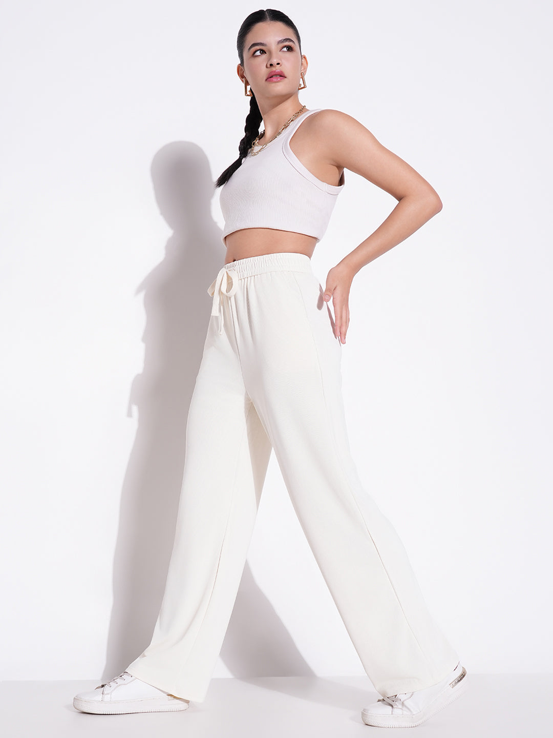 Women Cream Solid Parallel Trousers