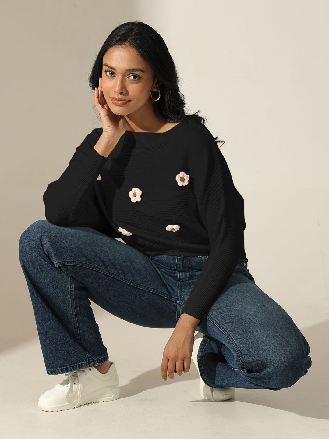 Women's Black Textured Knit Top with Flower Applique Detail