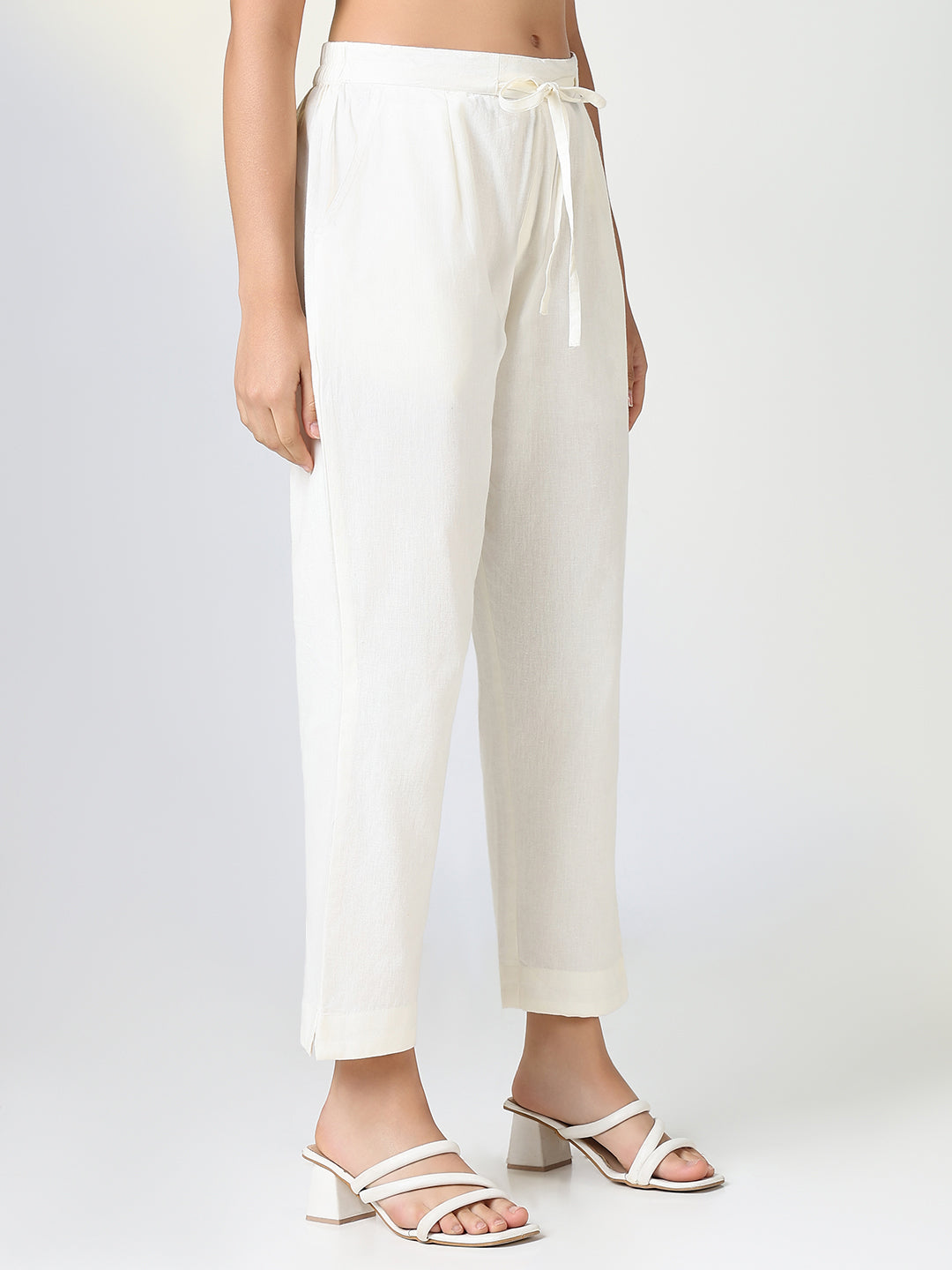 Women Solid Cream Slim Fit Trousers