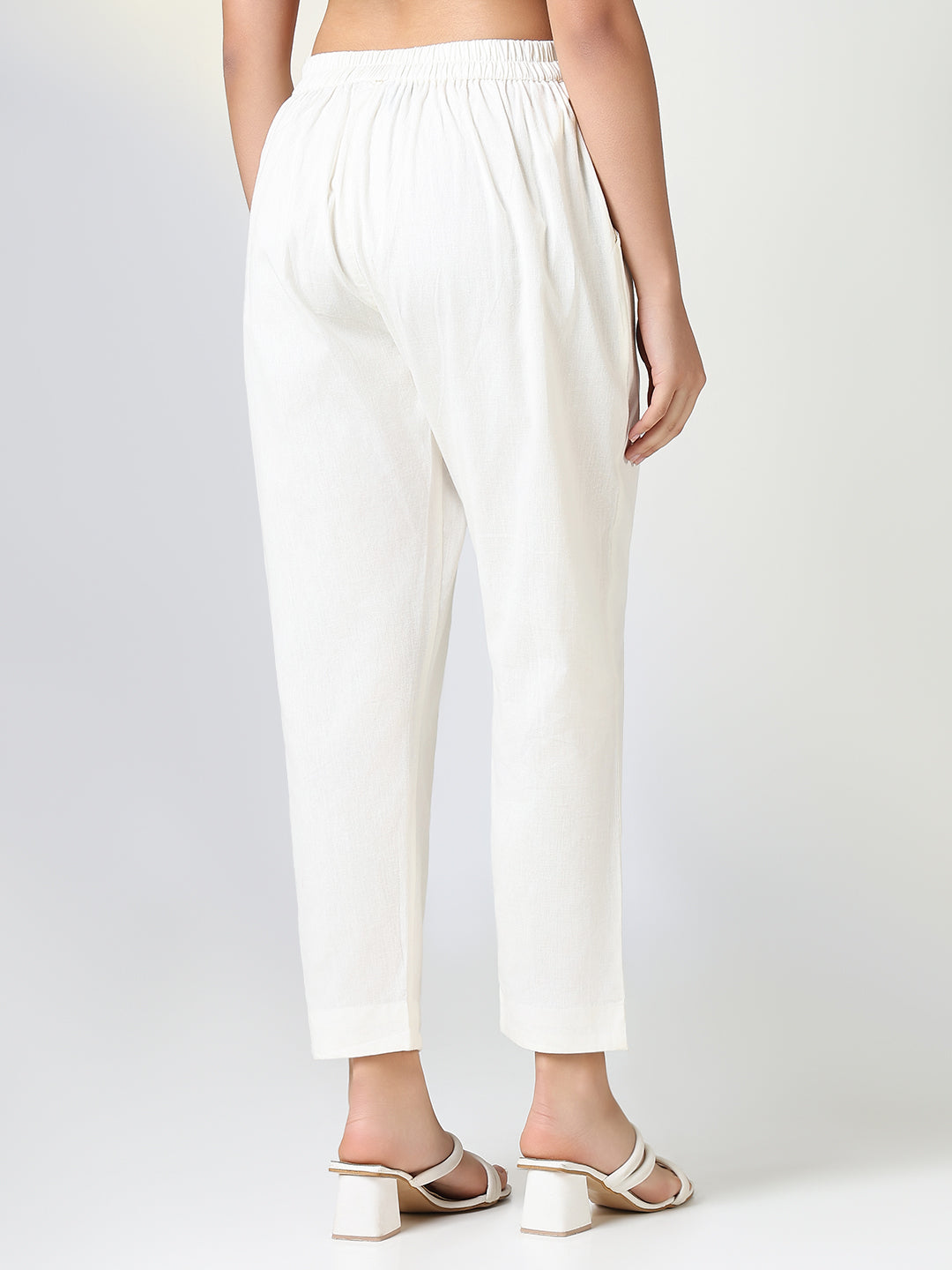 Women Solid Cream Slim Fit Trousers