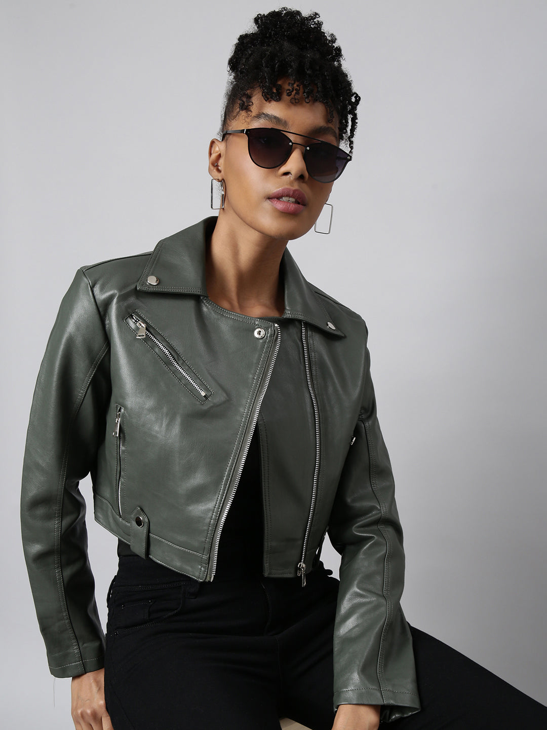  A woman wearing an Olive Spread Collar Crop Biker Jacket
